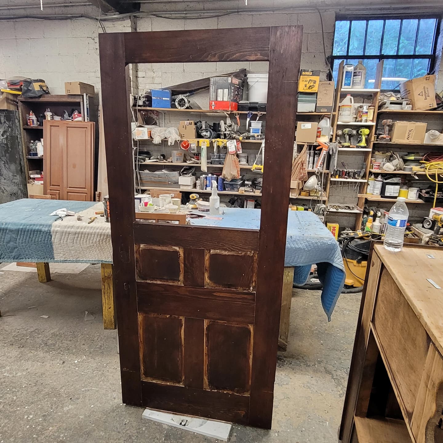 The same door after restoration, refinished in rich walnut