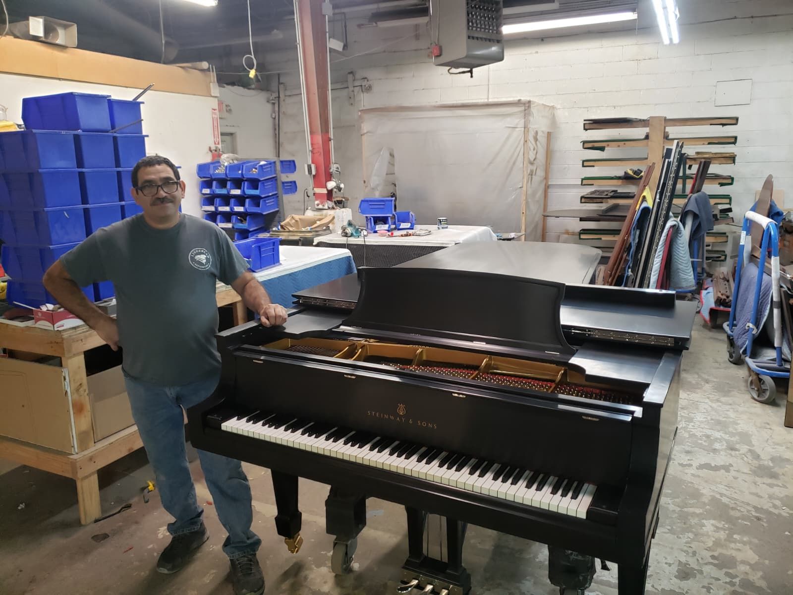 Reyman Quiros beside the restored Steinway grand