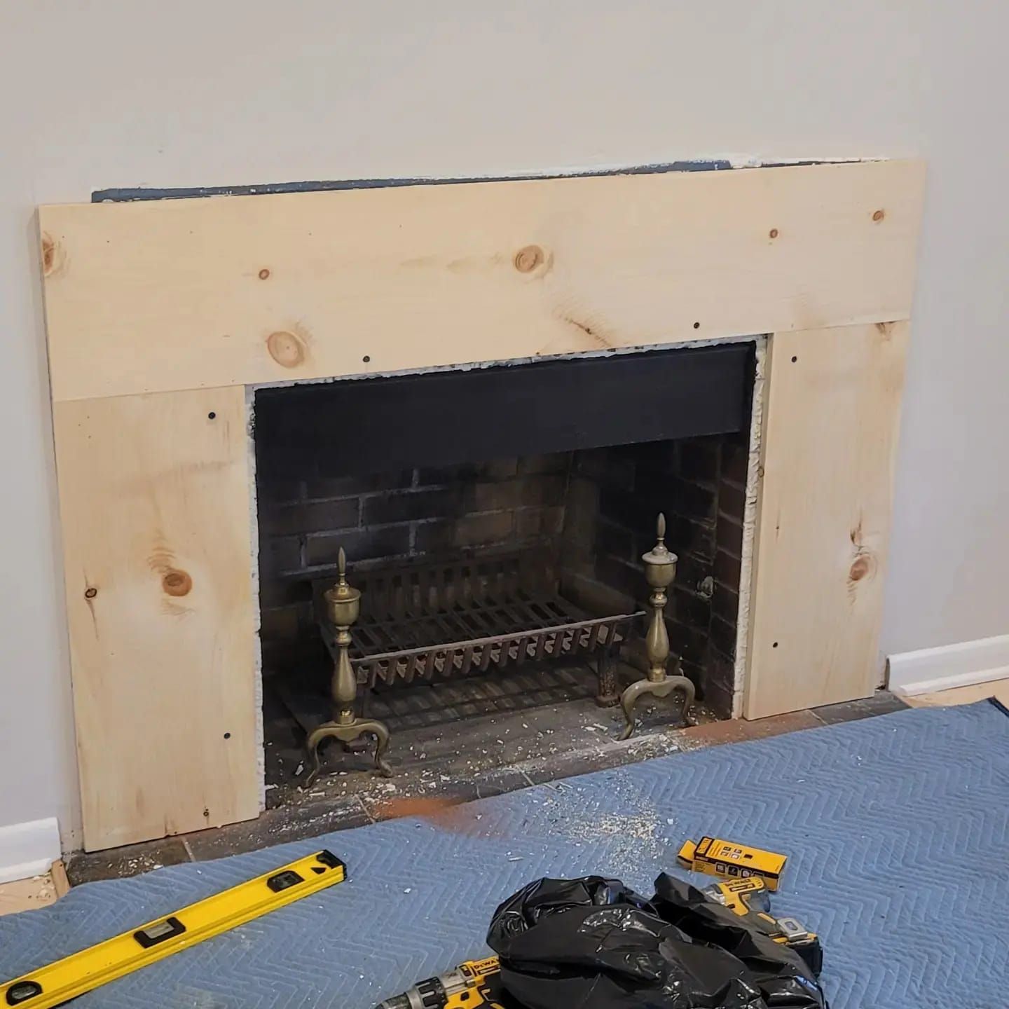 The mantel mid-build in raw pine
