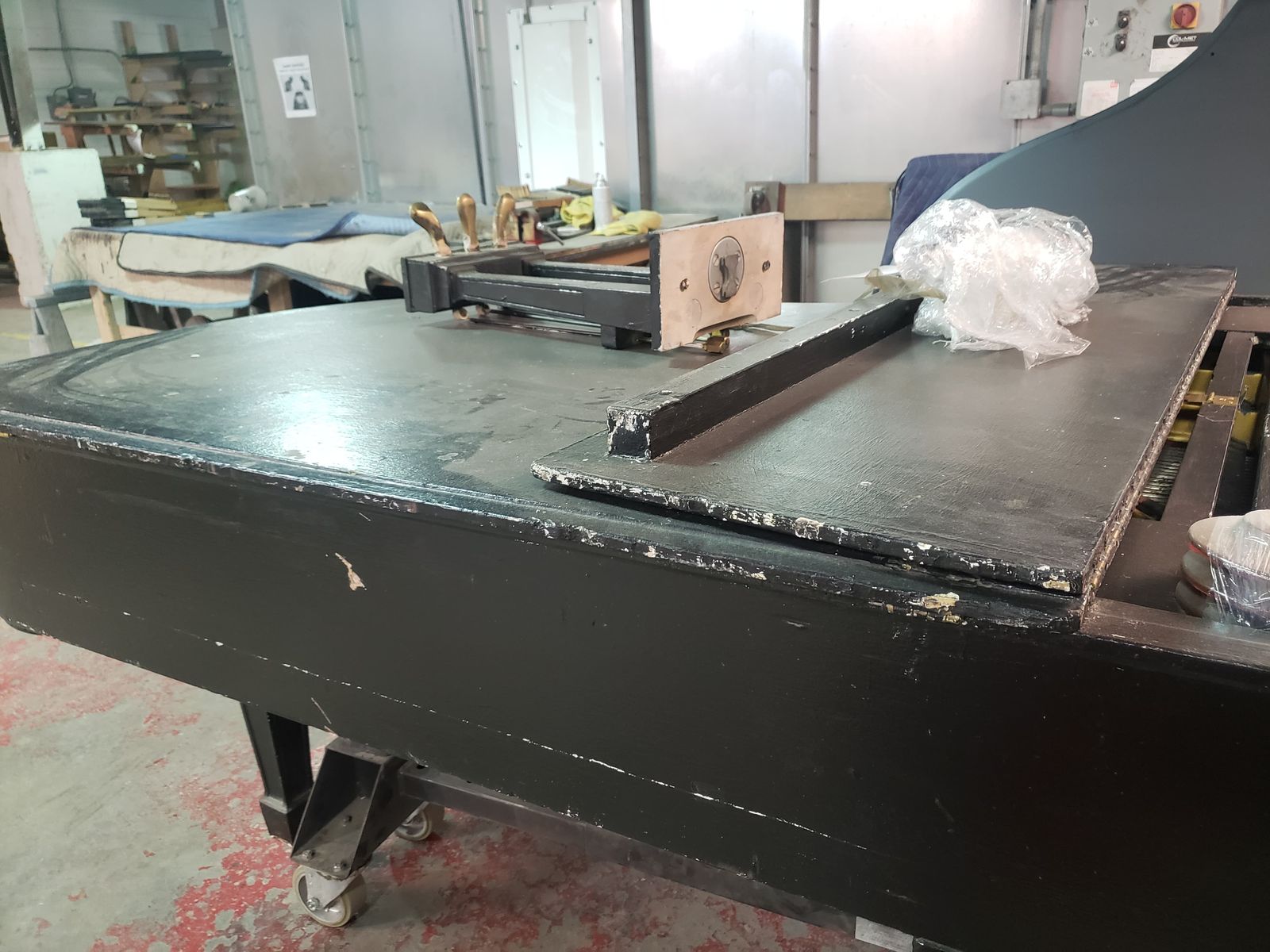 Grand piano before restoration, worn, chipped and dull