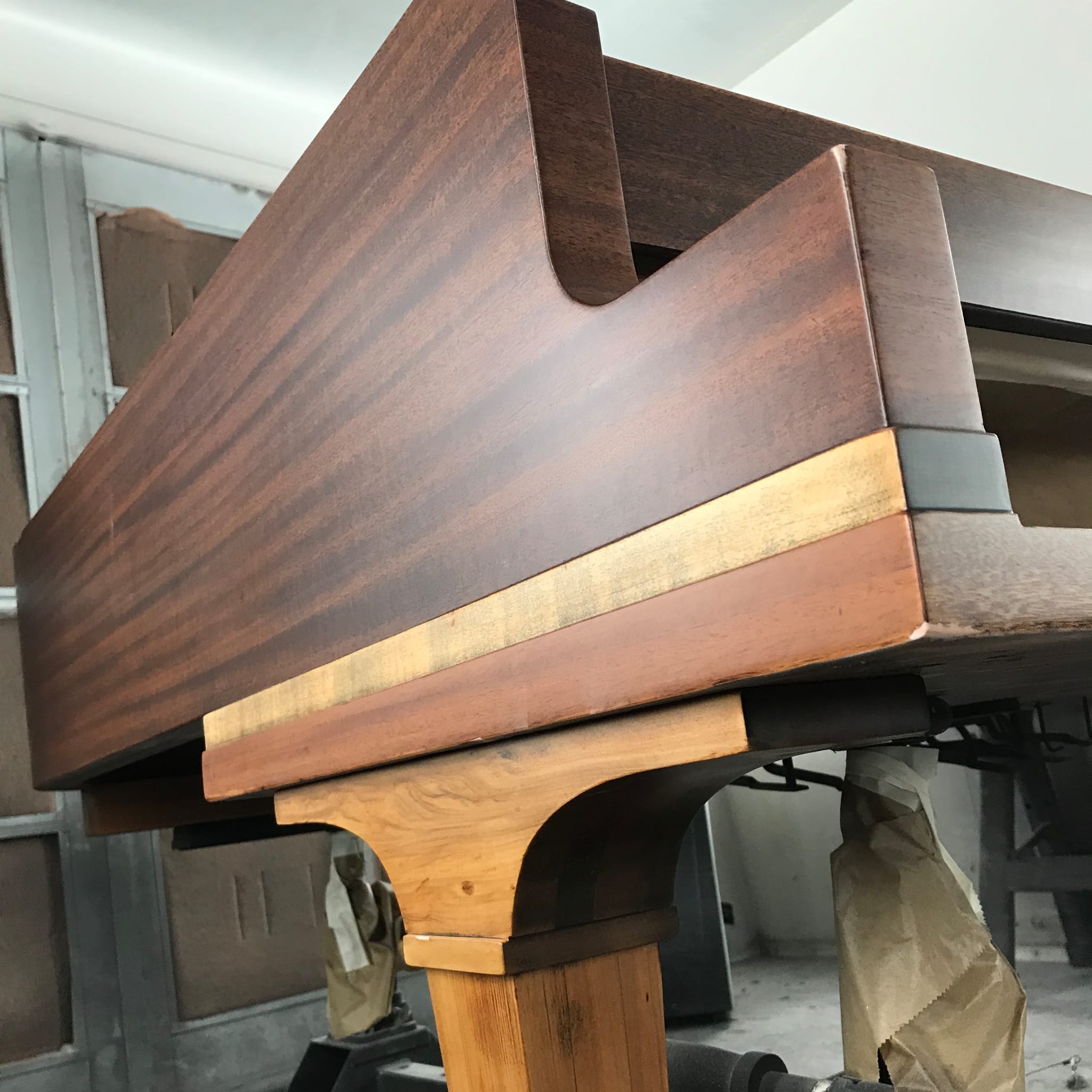 Detail of restored mahogany piano